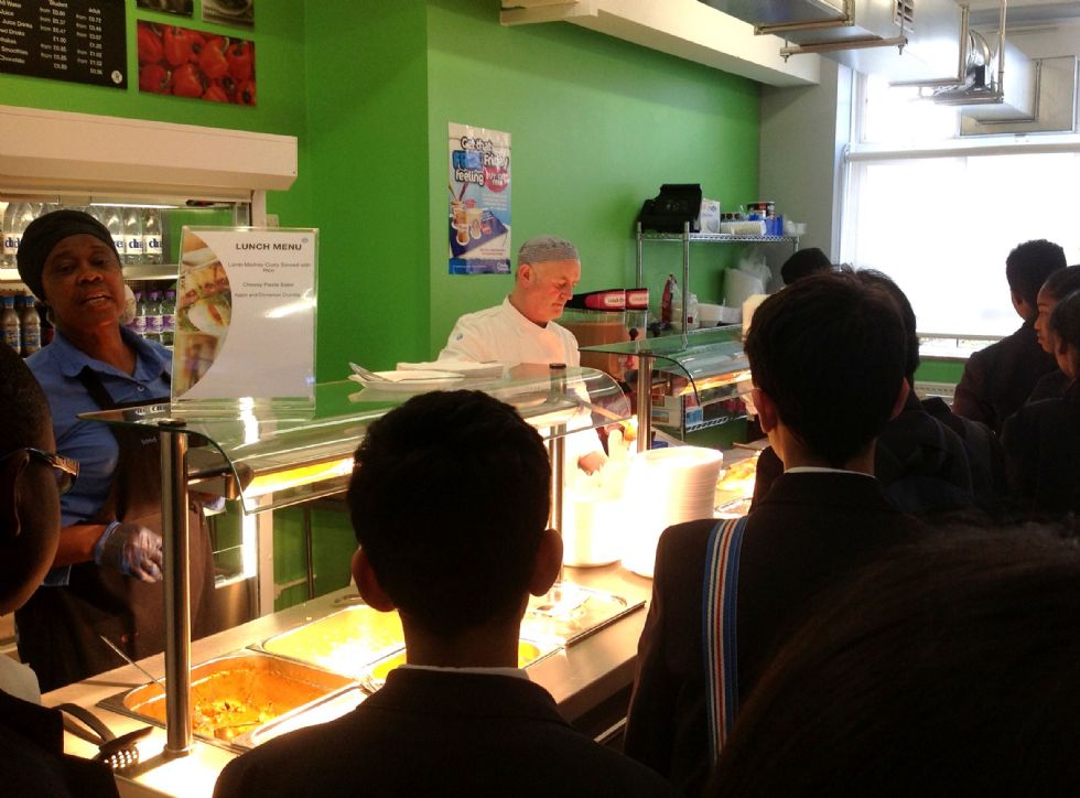  Photo of the Canteen staff serving food