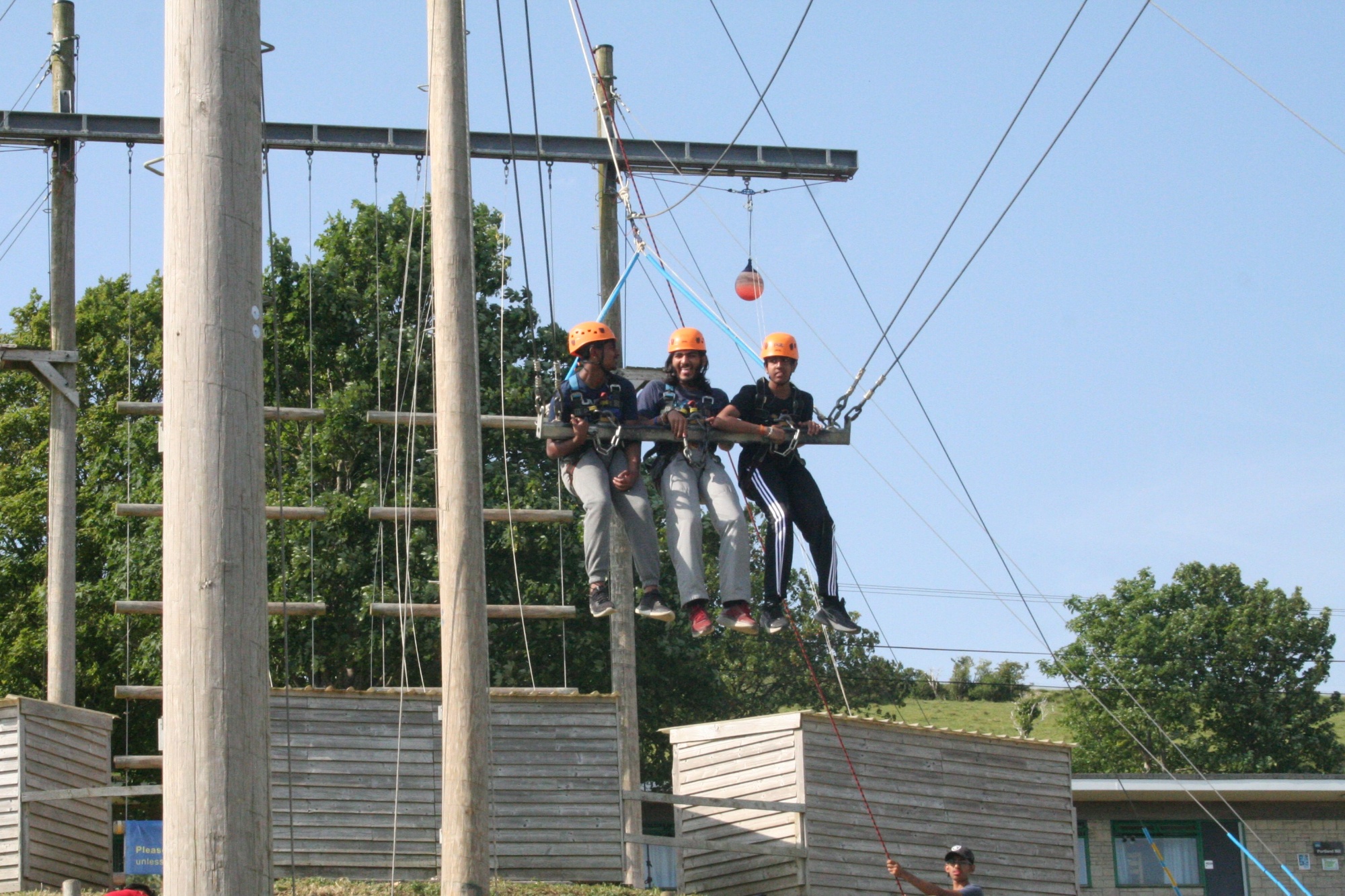 3 students on the giant swing